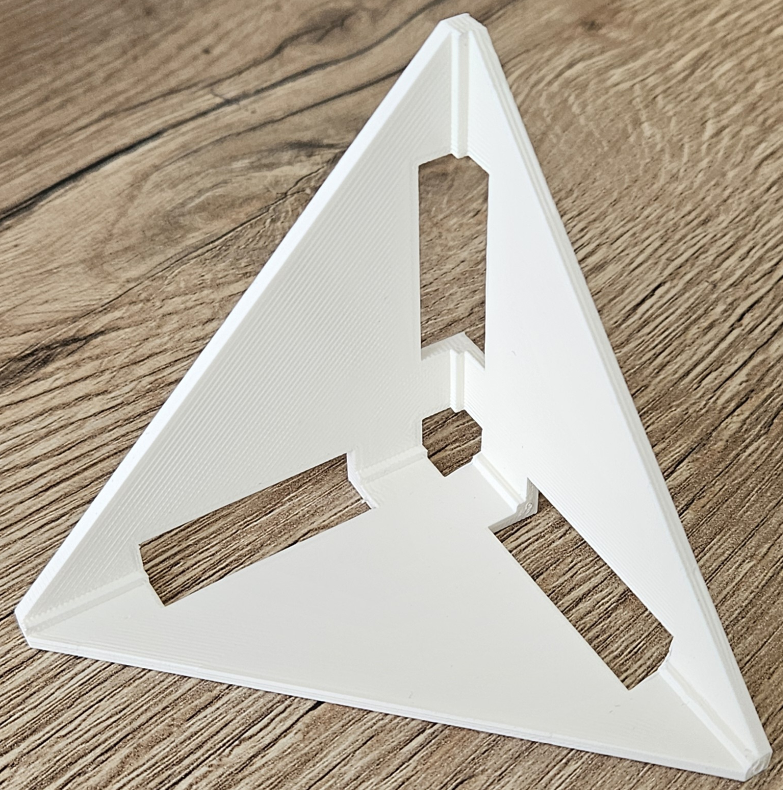 3d-printed jig to glue-together rectangles into a trihedral form